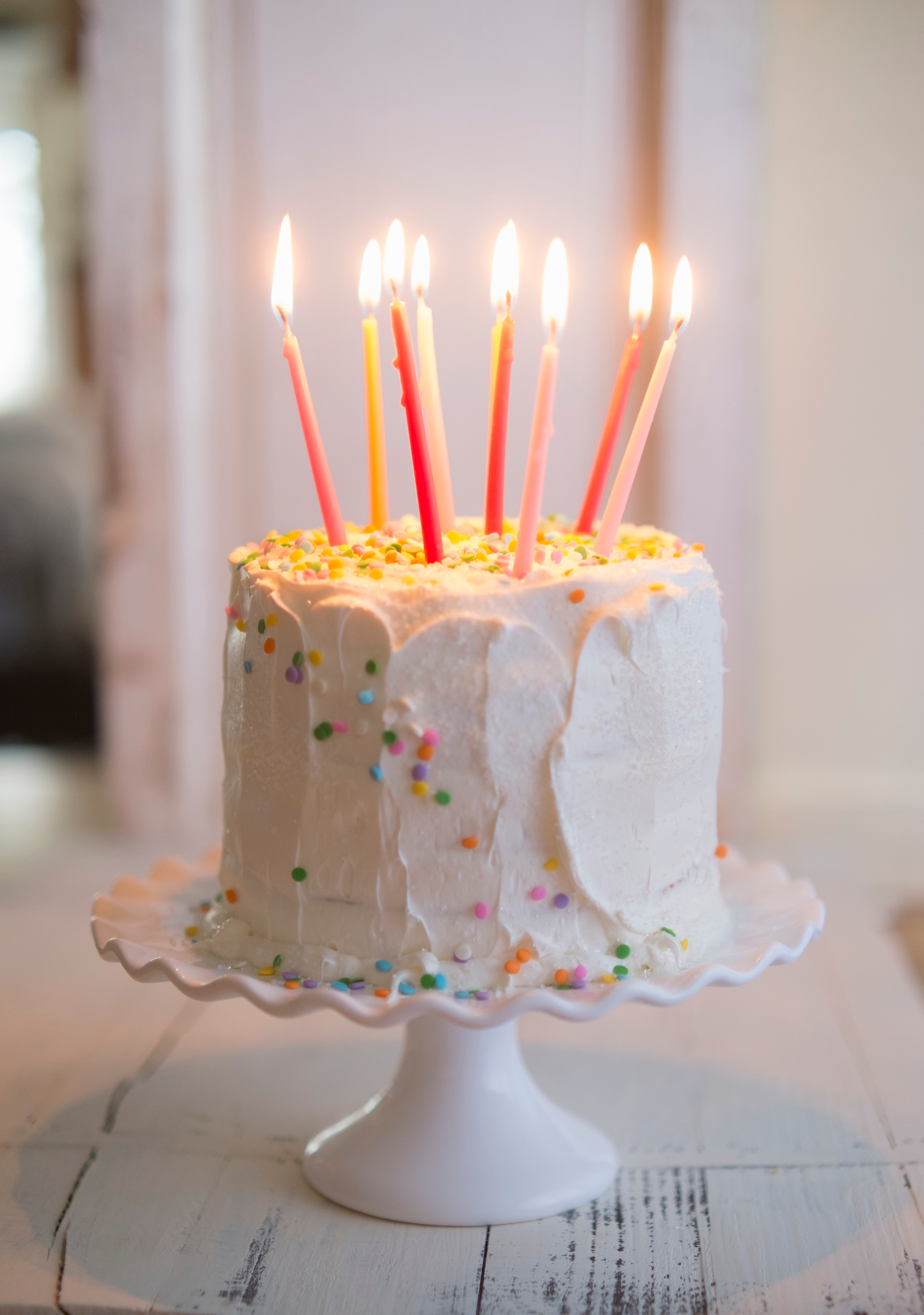 A candlelit celebration cake