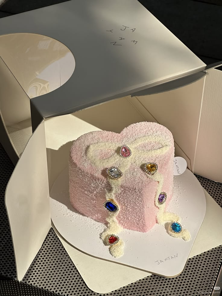 A pink jewel cake in a gift box